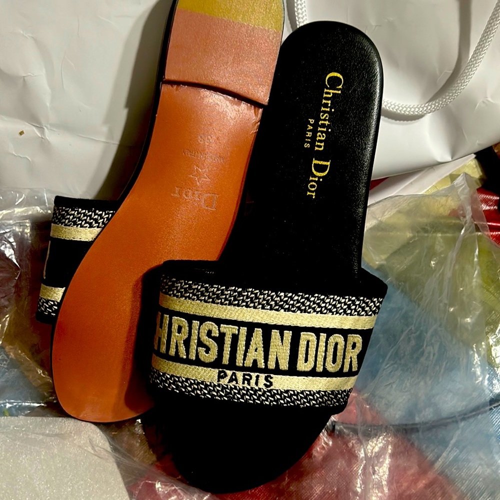 Christian Dior size 39 (8) still has the plastic.